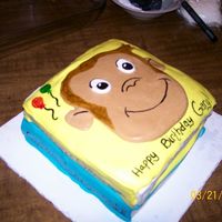 Curious George I made this cake for a friend of mine who grew up with Curious George Books. 11 x 15 cut and stacked, covered in MMF