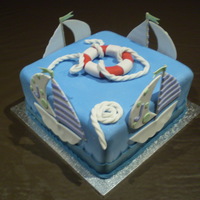 Boating Cake White Mud cake, white chocolate ganache and fondant icing.