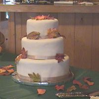 Fall Wedding This is a pumpkin spice cake with spiced bc covered in fondant. The leafs are gumpaste colored with food coloring.