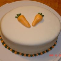 Cakes_009.jpg This was a very simple cake. I had never covered a cake with fondant before. So i gave it a try. Its a carrot cake with cream chesse icing...