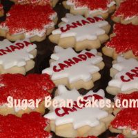 Canada Cookies Wow...we made a TON of these. They are to give out at our local Canada Day parade! Maple leafs with sugar crystals, and fondant