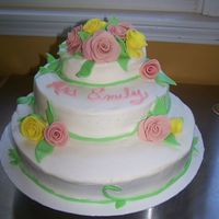 Round Tiered Birthday Cake This cake was for a lady's 99th birthday. The bottom layer is 12" round and the top layer is 2 6" rounds. Buttercream...