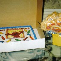 Elmo Cake And Cookies The crayons and Elmo on the cake are BCT. The cookie pops are covered with rolled buttercream and the Elmos are royal icing.