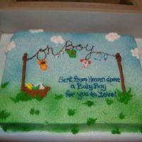 Boy Clothes Line Cake airbrushed buttercream icing, fondant clothes, and buttercream piping.