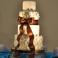 Delicate Flowers Layered flowers were made using the Cricut Cake machine to cut them out. Based on a photo given to me by the bride. I don't know who...