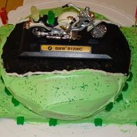 Motorcycle Birthday Cakae This is a birthday cake I made for my boyfriend. He loves motorcycles so I decided to do a motorcycle race track type cake.