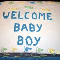 Baby Feet Yellow Cake filled with 1/2 Strawberry & 1/2 Pineapple. The invatations were printed on paper with baby feet as the border, so I used...