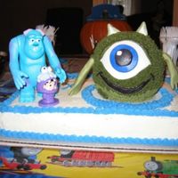 Monsters Inc. I made Mike using the 3-D sports ball pan from Wilton. Boo and Sully are figurines.