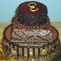 Choco-Gold 80 This is a cake I made for my best friend's dad. He's turning 80 and I've known the family since I was 14 ( a long long time...