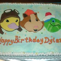 Wonder Pets Sheet/flyboat Smash This is a half sheet, all vanilla cake w/ Wonder pets faces made from fondant. The Flyboat smash cake is a cut 6 in. round covered in mmf...