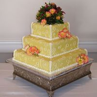 Fondant And Fresh Flowers Yellow fondant wedding cake with fresh flowers