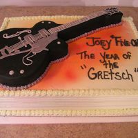 3-D Guitar 3-d guitar, airbrushed on top of a 1/2 sheet cake