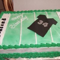 Oakland Raider Cake Half sheet cake, iced with whip cream and decorations made out of fondant