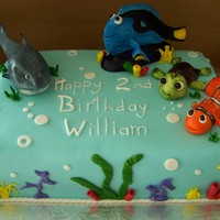 William's Nemo Nemo cake made for a boy turning 2! Yellow cake with Vanilla Mousse. Gumpaste characters, fondant decorations.