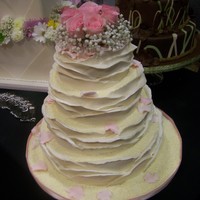 Chocolate Wrap Cake dummy decorated for a bridal show. I was disappointed in how the pic turned out....the roses weren't nearly as pink as they seem...