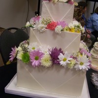 Envelope Cake Dummy decorated for a bridal show.Panels made of white chocolate.