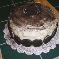 Cookies And Cream Chocolate cake with cookies and cream filling covered in cream cheese icing and oreos