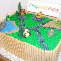 Zoo Birthday Cake Chocolate cake with chocolate mousse filling, animals are marzipan, fence is pirouette cookies