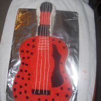 My 6Th Character Cake Ever Nothing fancy, simple boxed cake mix, store bought icing, & my own version of the Guitar since I didnt have a picture to go off of.