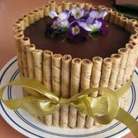 Edible Flowers On Chocolate Cake This cake was inspired by Chica07's lovely cake. I made it for my Mom for her birthday and she just loved it. The flowers were an...