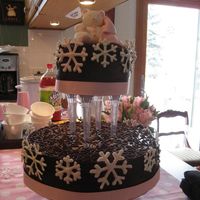 Winter Baby Shower - Snowflake Theme Chocolate cake with raspberry buttercream, covered in chocolate ganache and then decorated cornelli lace with more ganache. Bear and...