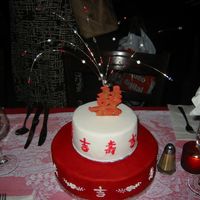 Double Happiness Cake For chinese wedding - White cake with raspeberry and vanilla buttercream layers. Topper means Double Happiness, a traditional Chinese...