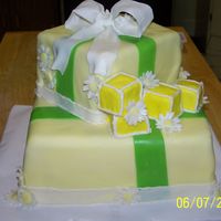 Baby Shower Cake 10" and 6" square.. MMF covered MMF bow. I am NOT a professional by any means, but the girl loved it. I also wrote Baby on the...