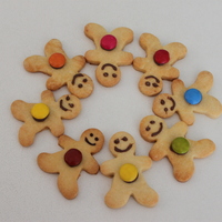 Wreath Of Friendship shortbread cookies, piped in choc and smarties for buttons