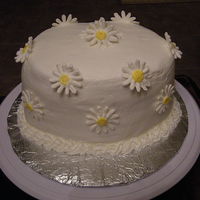 Daisy Cake I did this cake as a favor for a friend with a days notice. So I know it is not perfect but I did it anyhow. It is a white cake with butter...