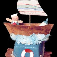 Sail Boat Baby Shower Cake This is my first baby shower cake using fondant and gumpaste, This is a practice cake. The other cake is more ornate.