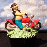 Dude On A Bike Cupcake! This was a Fathers Day cupcake I made for a competition on Flickr in the group Flickr Bake- Off!