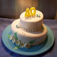 Ruths Topsy Turvy Birthday Cake This is my fist topsy turvy cake, The leaves are hand painted onto the cake, frangipannis anr made from gumpaste and the cake inside was...