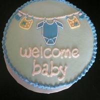 My Version Of Clothesline Cake this was for a friend who wanted a simple clothesline cake. butter cream w/ fondant accents