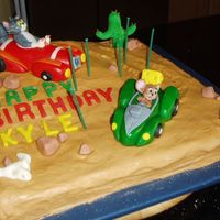 Tom & Jerry This is my sons 6th Bday cake. He was very specific about what he wanted Tom and Jerry in race cars in the desert and all the dils on the...