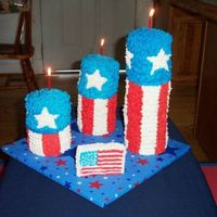 Side View July 4Th Firecracker Cake 5th cake I've made... Used an idea from a friend's craft project made from firewood. The sizes: round- appx 6in; heights - 12in,...