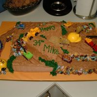 Under Construction Inside every big boy, is a little boy that likes to play with trucks...no matter what his age...