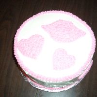 Hearts And Kisses First cake using the cookie cutters and star tip. Boy I need a lot of practice!