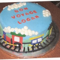 Train Cake Made for a patient who finally went home months after he was born. Covered in buttercream with fondant decorations.