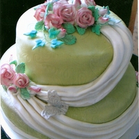 25Th Anniversary Made for my son's friend's parents anniversary. Covered in fondant imprinted with a paisley print mat. Roses are gumpaste. The...