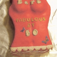 T-Shirt cake is covered in fondant with fondant decorations. Made for a friend who lost 70 lbs just before she turned 50.