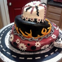 Odd Wedding Cake mild topsy turvy covered in mmf. all decorations are mmf except for gumpaste flowers