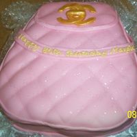 Channel Purse This was my first attempt at a purse cake. It was made for my friend's mother. The cake was yellow with vanilla buttercream and all of...