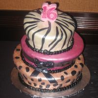 Sweet 16 Topsy Turvy This cake was decorated to match the invitation. The ribbon and other decoration was made with fondant and painted. Thanks for looking!!!