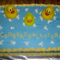 Rubber Duck Theme I did this cake for a Baby Shower. I wanted to come up with something catchy to say and I came up with "Conquackulations!" She...