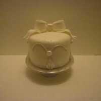 Small Wedding Cake I made this for my friend who had a very, very small wedding. White wedding cake with strawberry filling decorated with fondant