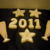 Happy New Year! sugar cookies decorated with rolled butter cream and luster dust