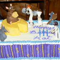 Ratatouille Cake Ratatouille birthday cake for a young girl. Banana nut cake, fresh banana and buttercream filling, with vanilla almond icing.