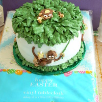 Flyin Monkeys Banana nut cake with fresh banana and buttercream filling, iced in buttercream. The top monkey got a little smashed in the travel home.