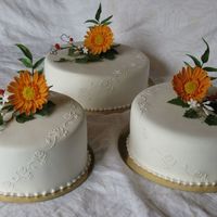 Wedding Cakes Filled with lime mousse and strawberry mousse. The flowers are gerbera, ivy, jasmine and a tvig of Celastrus.