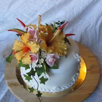 A Cake For My Husband To Take To Work... I replaced the flowers with something smaller before he took it though...:-)The gum paste flowers are hibuscus, rose, jasmine, chili fruits...